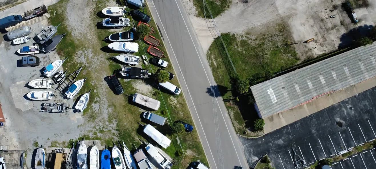 Aerial view of the fenced boat and RV storage lot next to Apogee Upholstery in Venice, FL