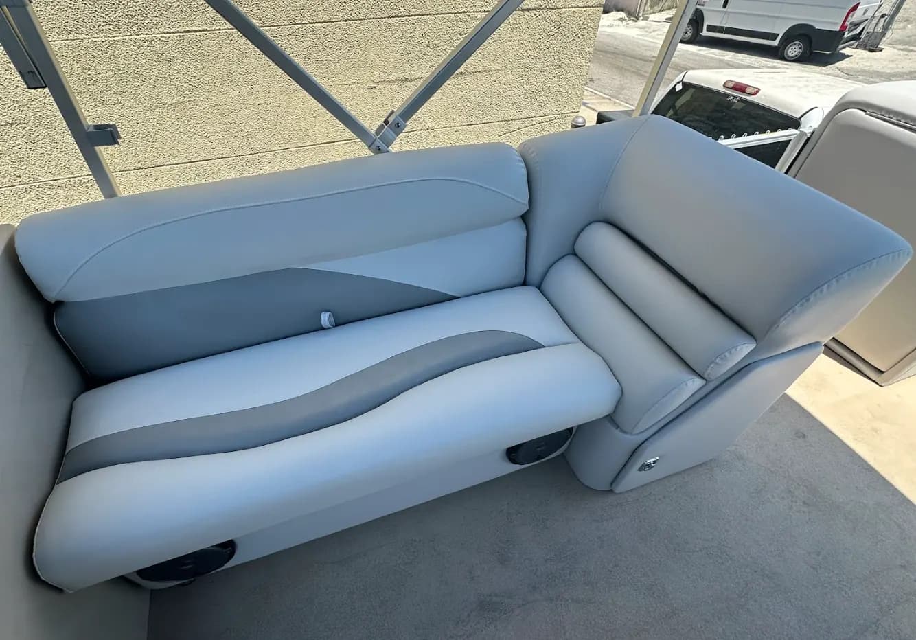 Boat seat recovered in grey marine vinyl, ready for installation in Venice, FL