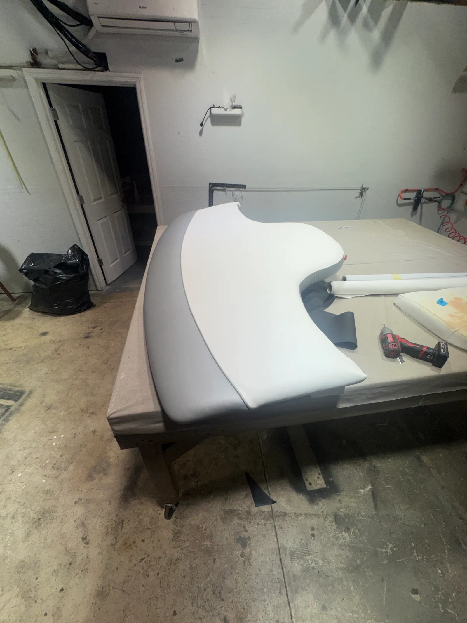 Bow cushion foam being shaped on the bench in the Venice, FL shop