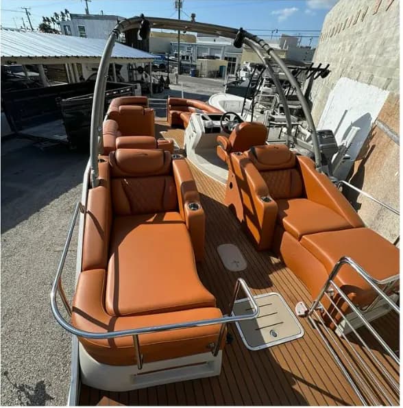 Burnt orange lounge seating on a luxury pontoon boat