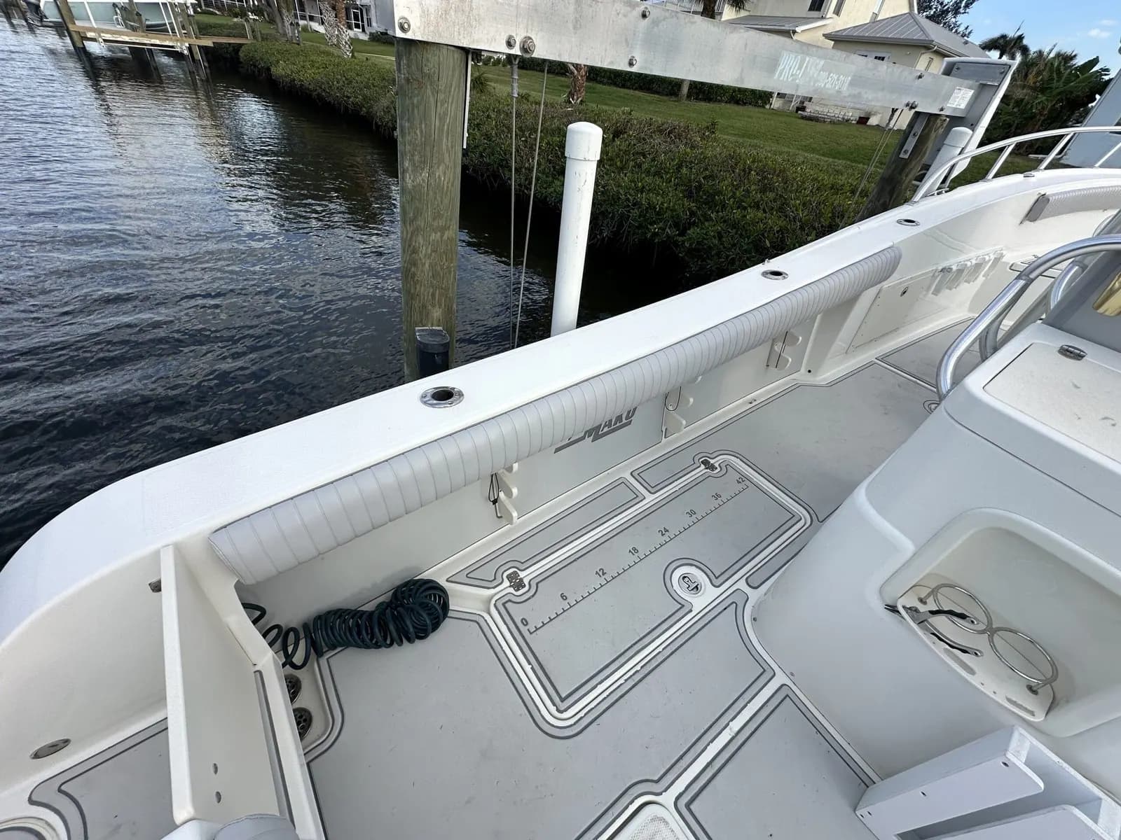 Grey marine vinyl bow cushions on a center console boat