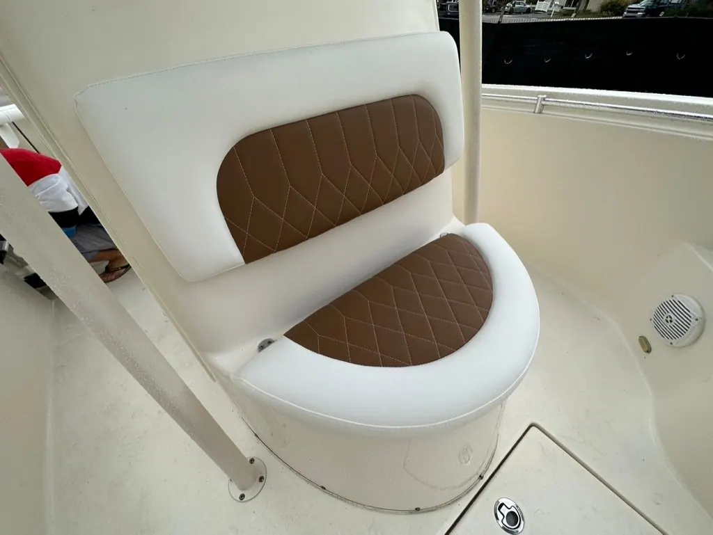 Diamond-stitched leaning post cushion in white and tan marine vinyl
