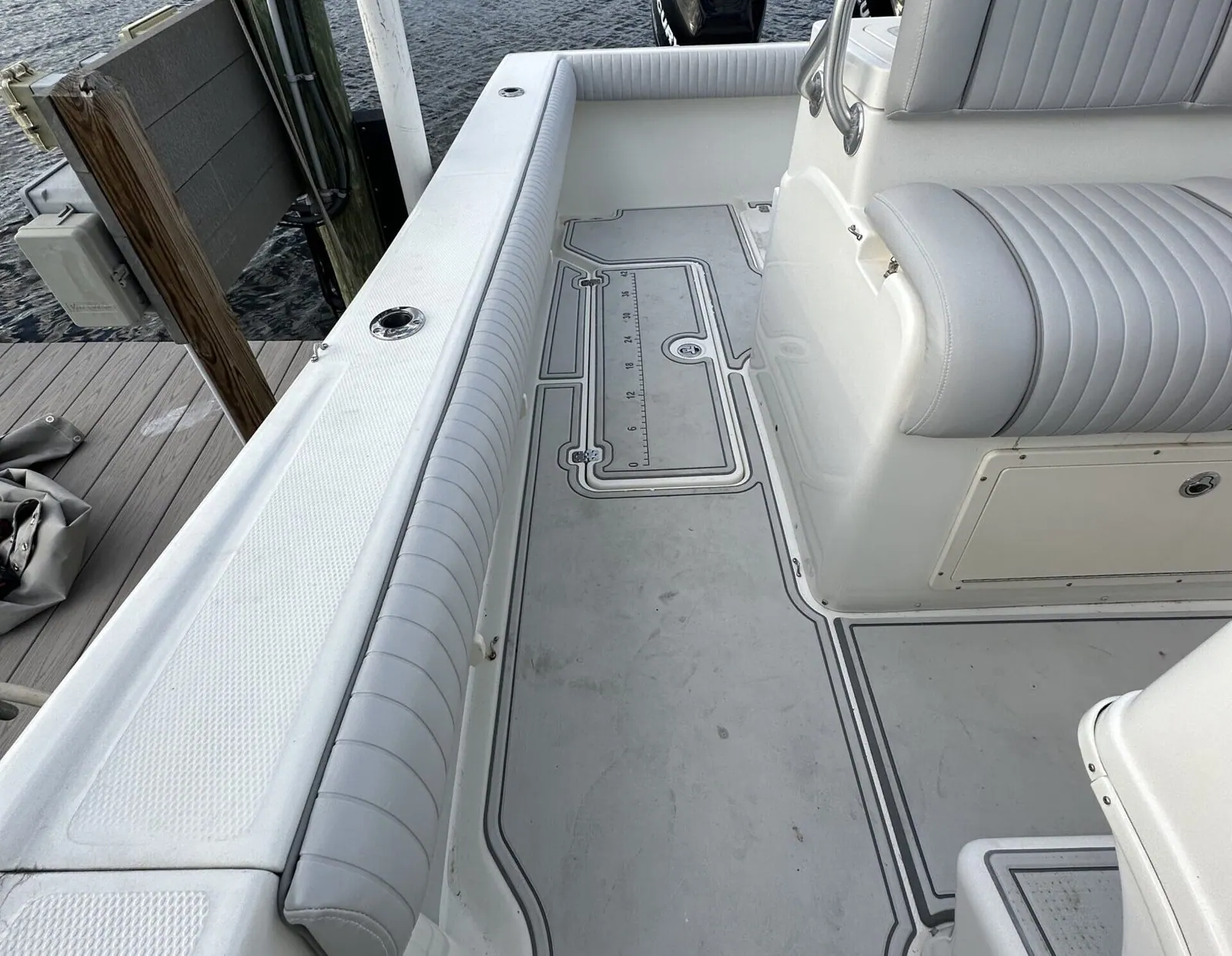 Stern seating in grey marine vinyl on a center console boat
