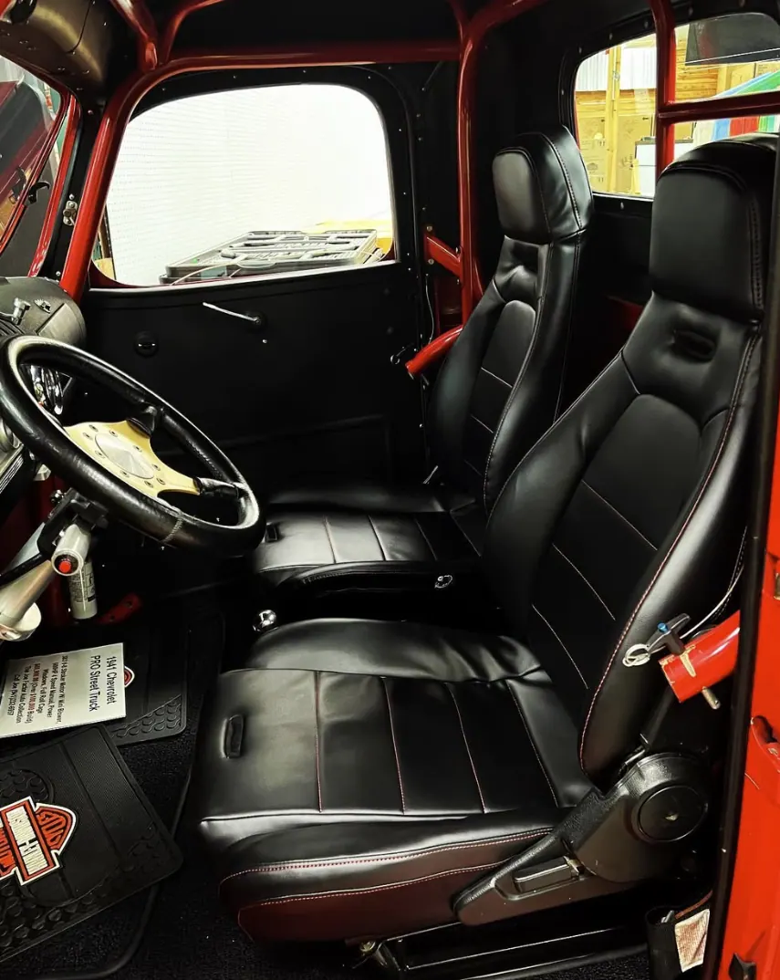 Classic pickup truck interior with new black leather seats