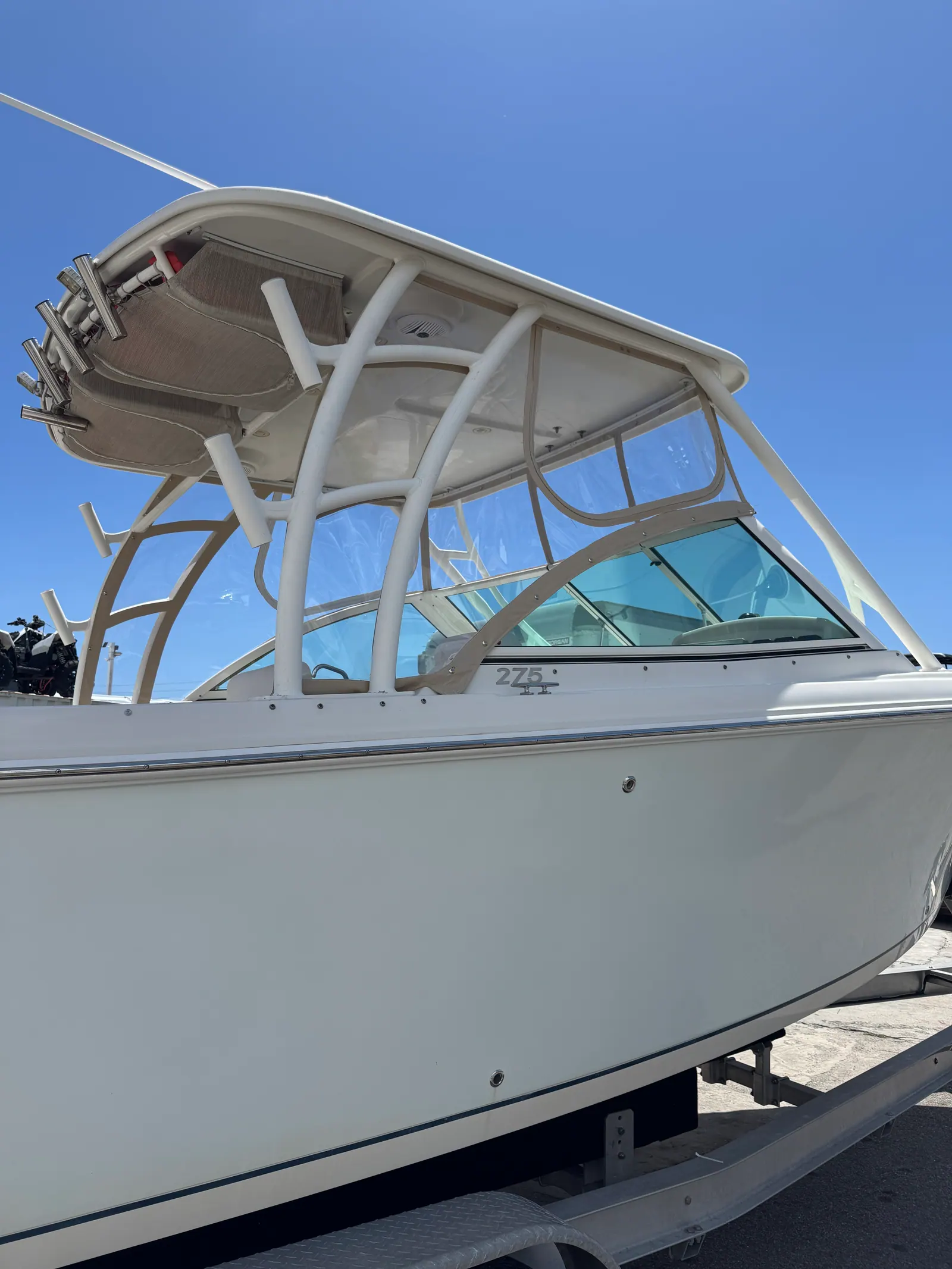Large center console with a full clear vinyl hardtop enclosure, exterior view