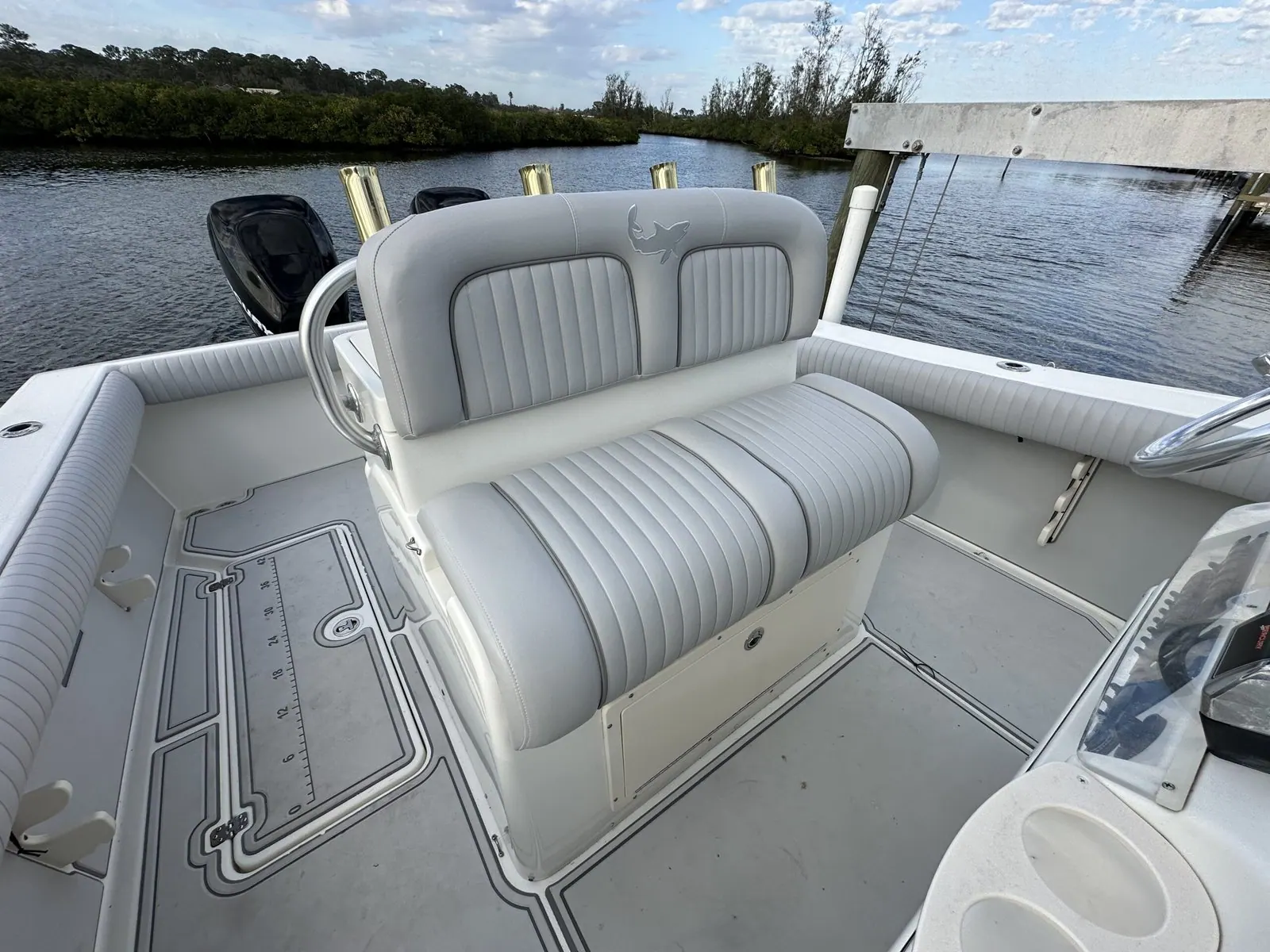 Helm bench seat reupholstered in patterned grey marine vinyl