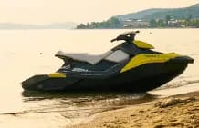 Jet ski on the beach at sunset