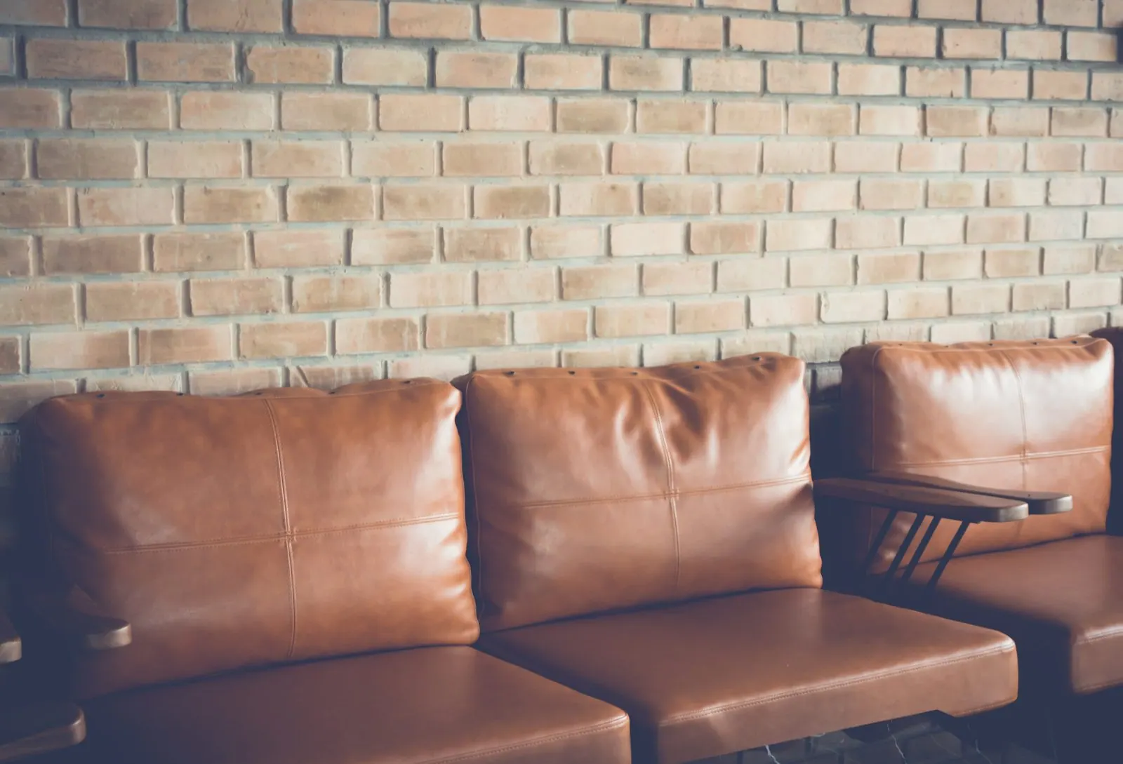 Leather lounge seating in a commercial space, the kind of seating we rebuild with new foam and covers
