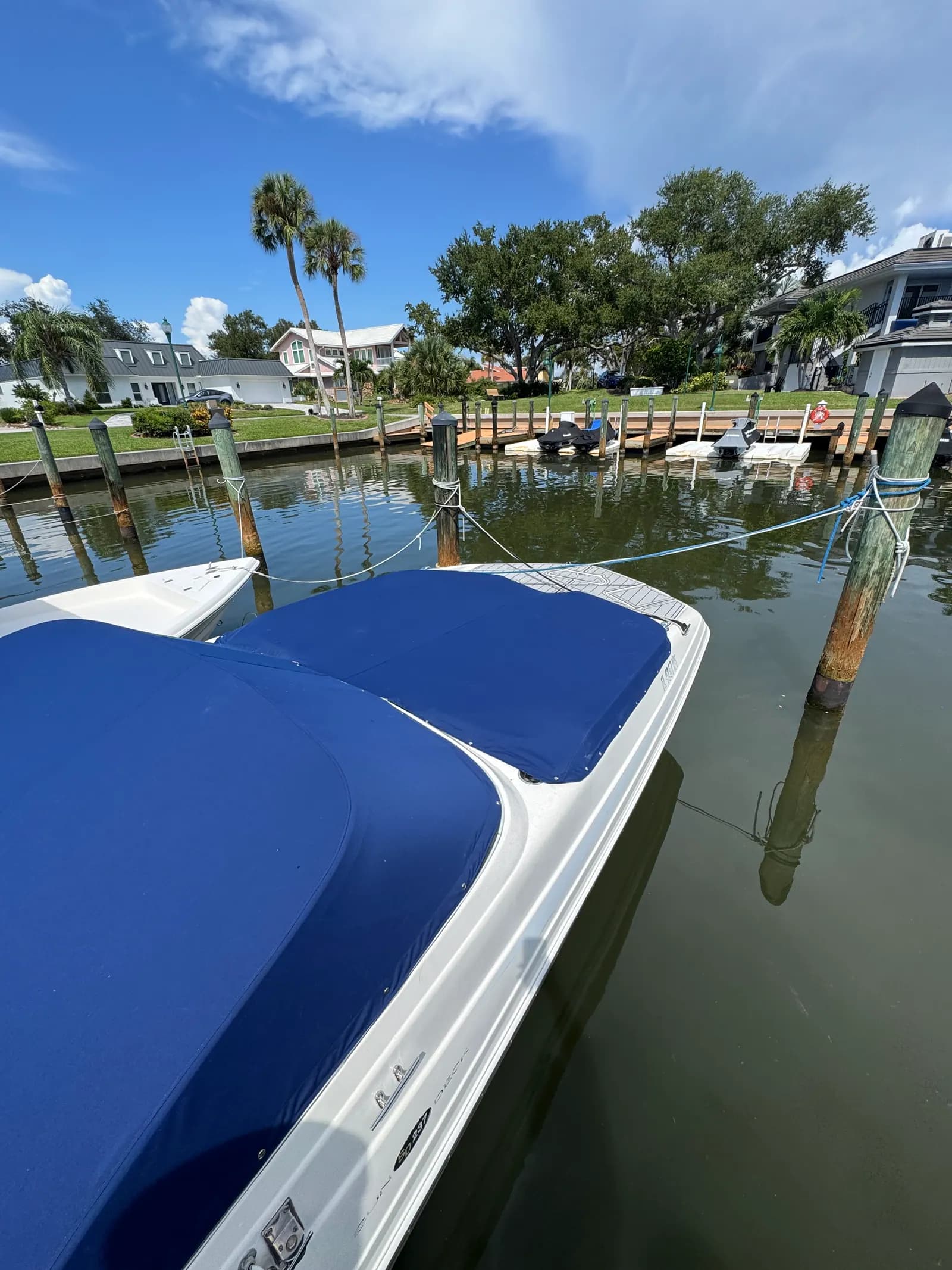 Navy custom mooring cover on a canal-kept boat in Venice, FL