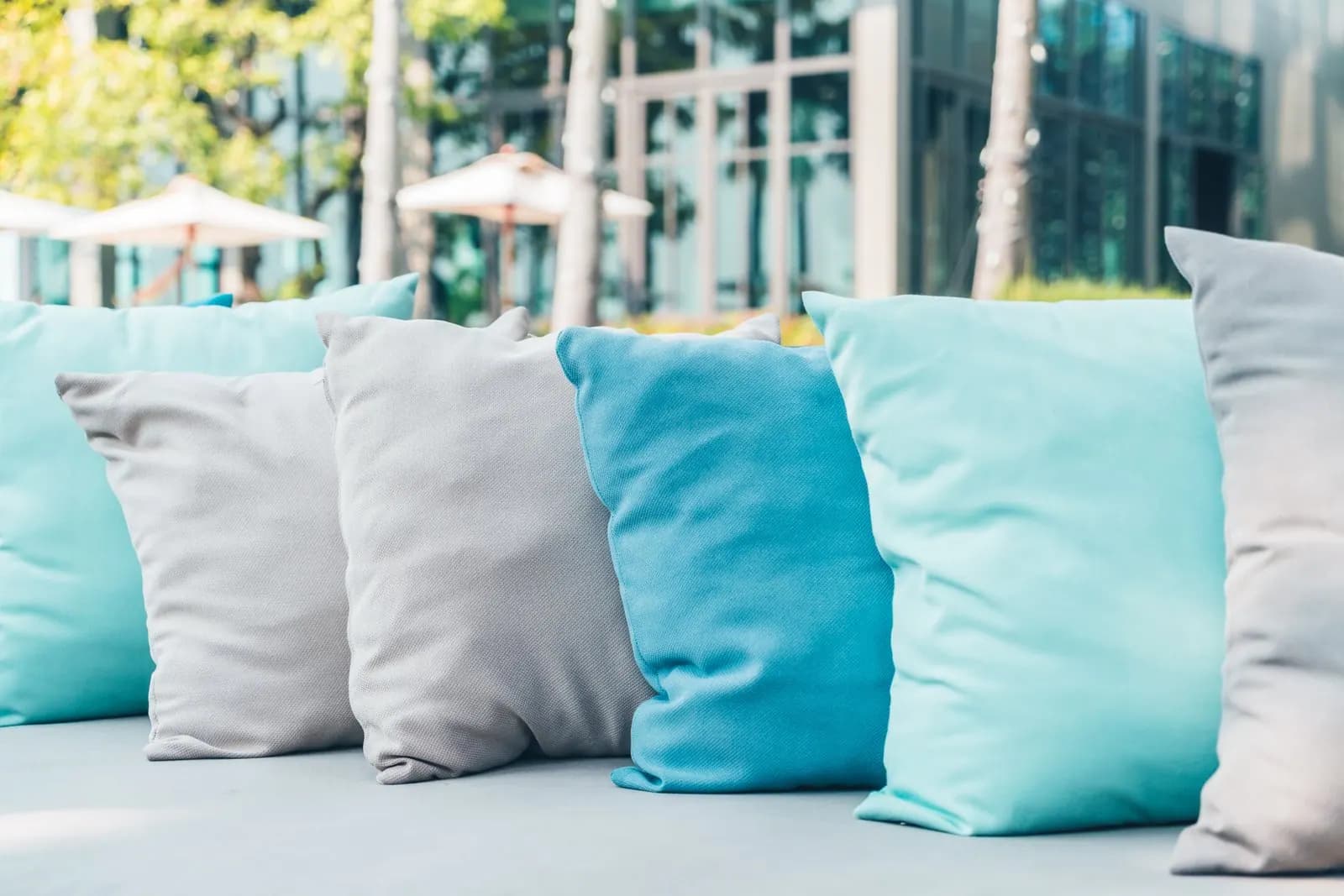 Patio lounge chairs with white and blue cushions