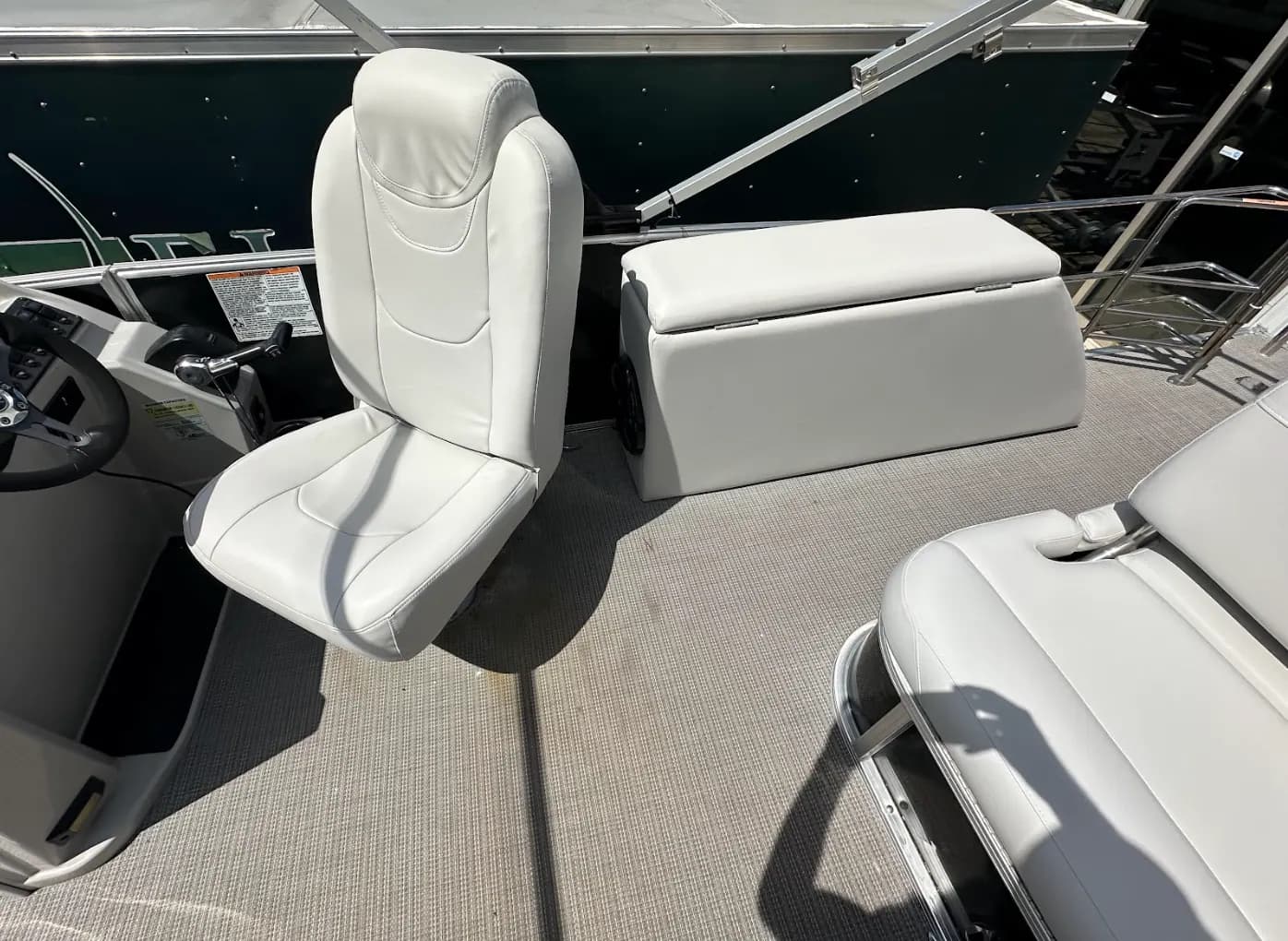 White captain's chair reupholstered on a pontoon boat