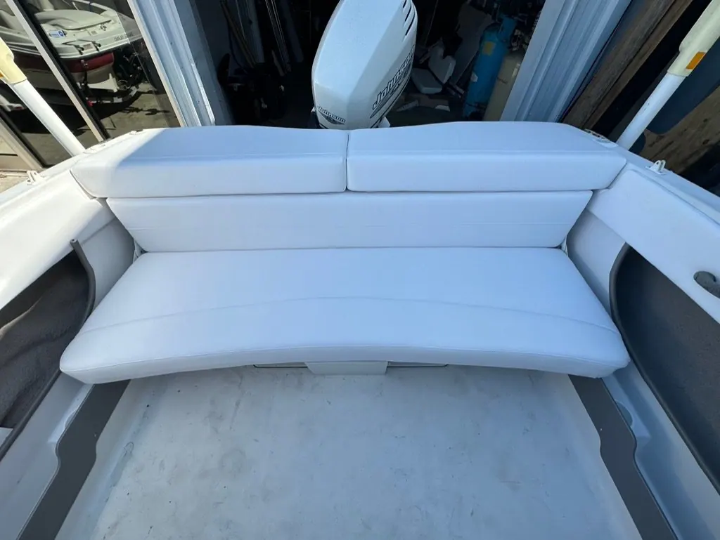 Rear lounge seating reupholstered in light grey marine vinyl