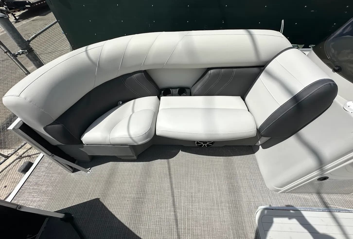 Wraparound lounge seating on a pontoon boat after reupholstery
