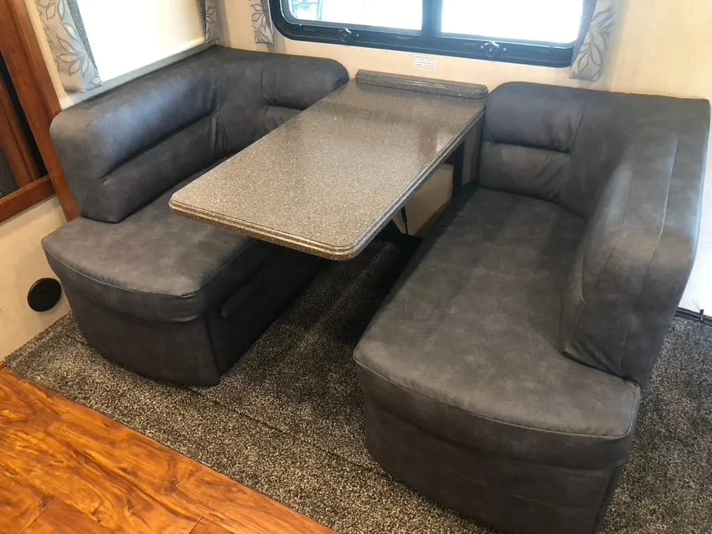 RV dinette booth reupholstered in grey fabric
