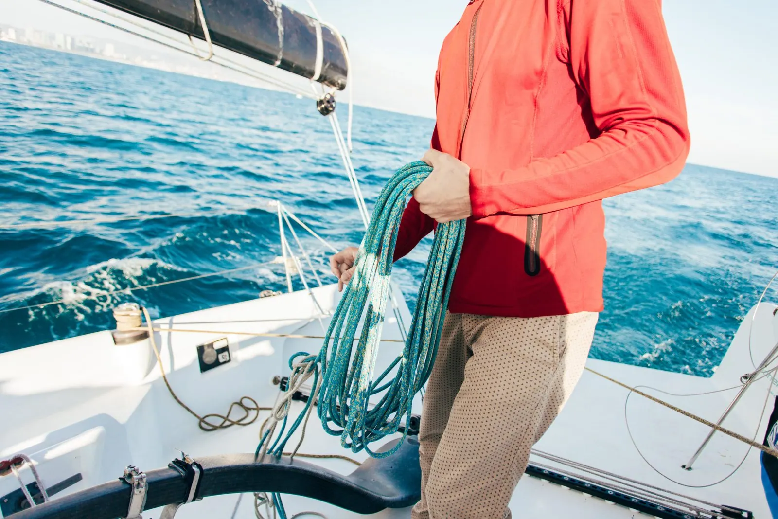 Sailor handling lines on a private yacht