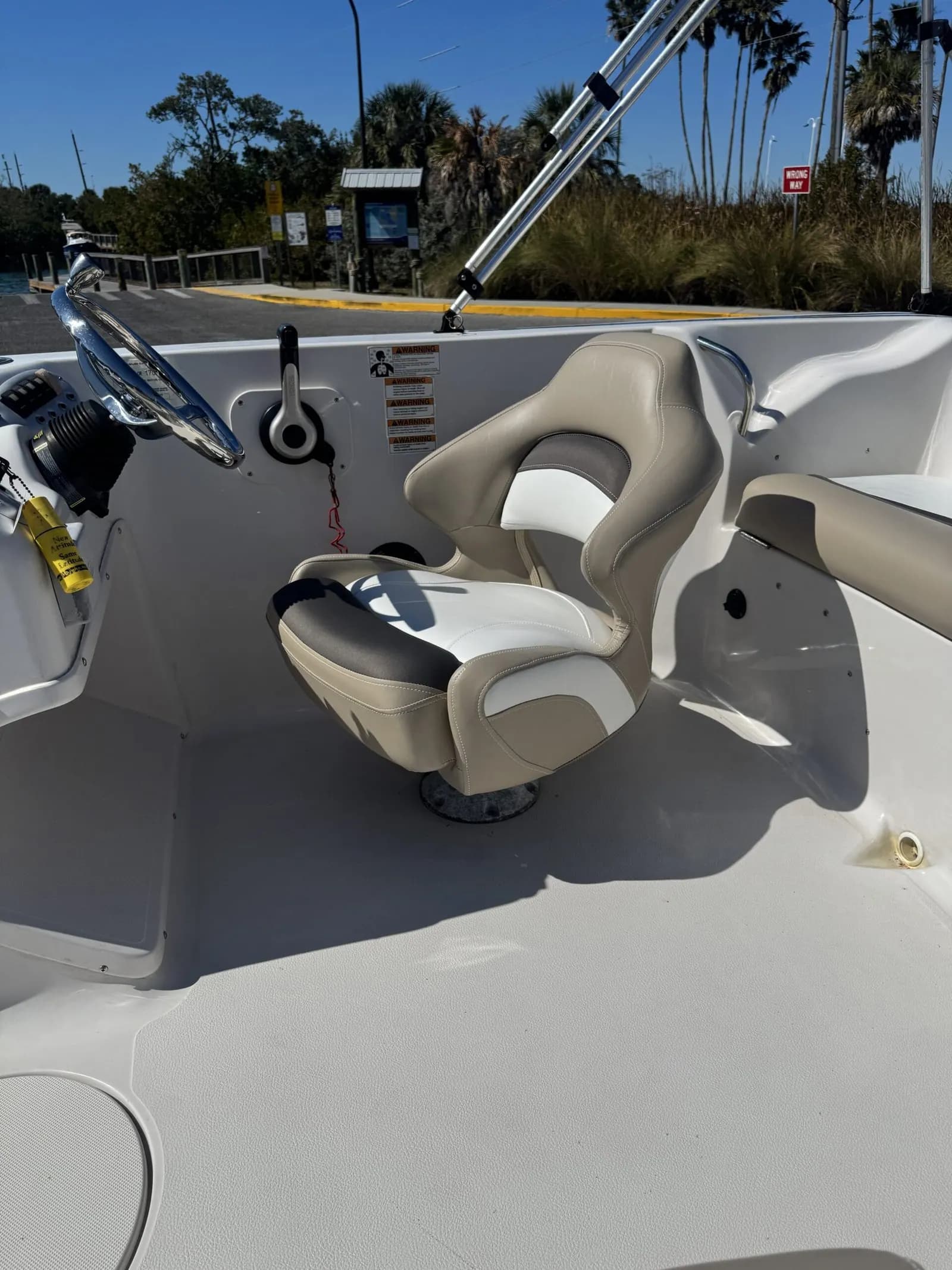 StarCraft 2000 deck boat interior restored in tan and white marine vinyl