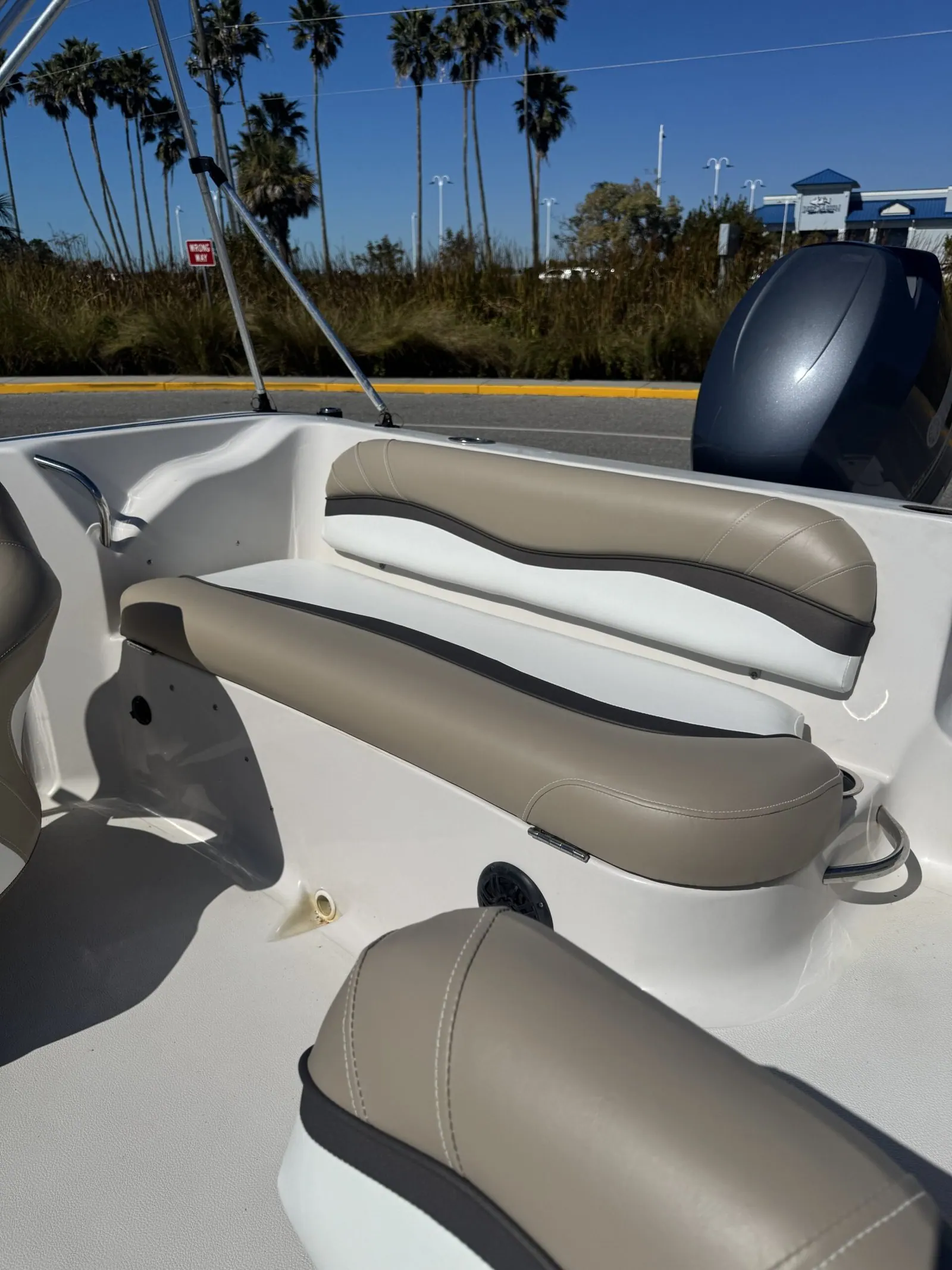 StarCraft 2000 stern wrap-around bench restored in tan and white marine vinyl