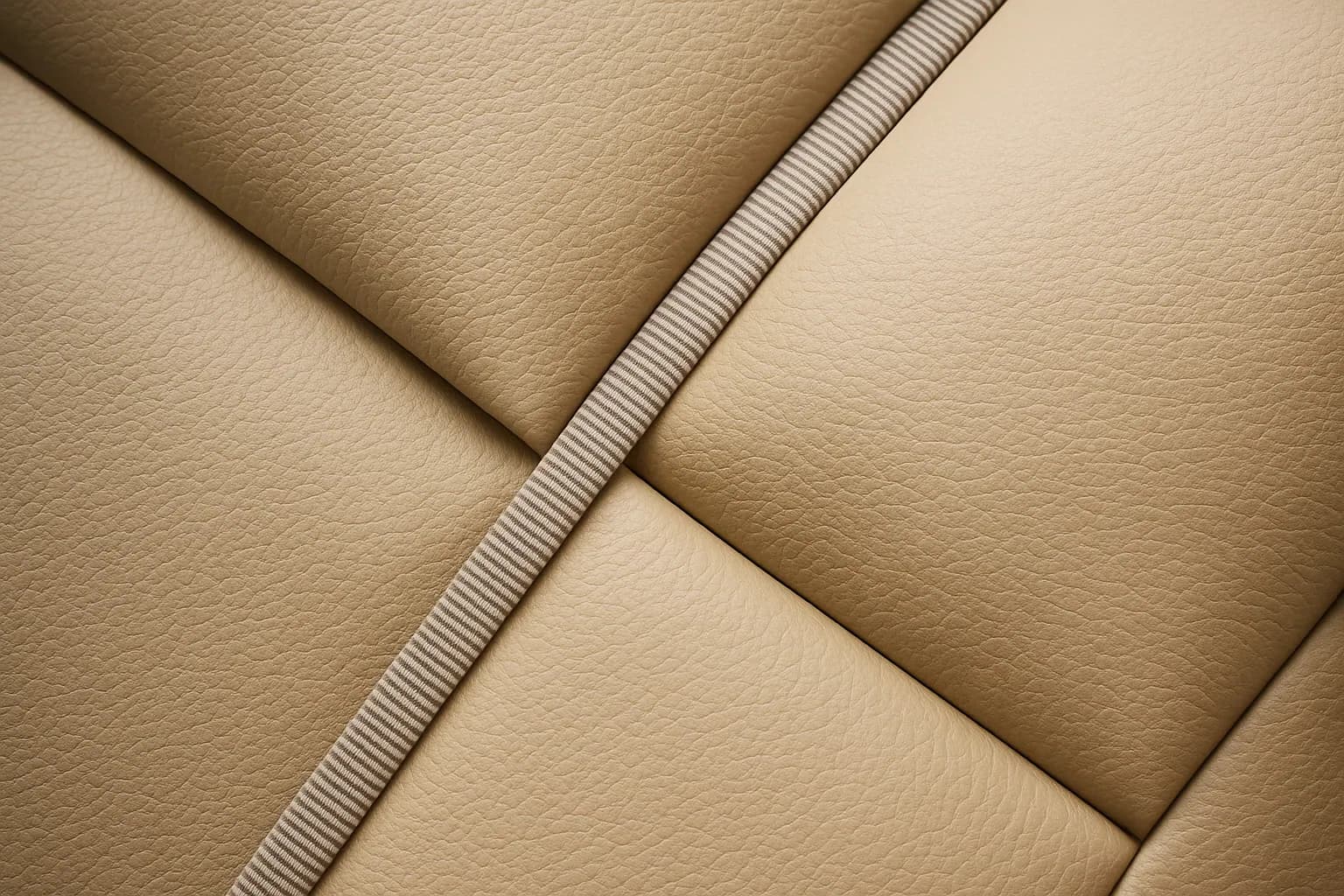 Tan diamond-stitched marine vinyl cushion with a tape edge seam, sewn in Venice, FL