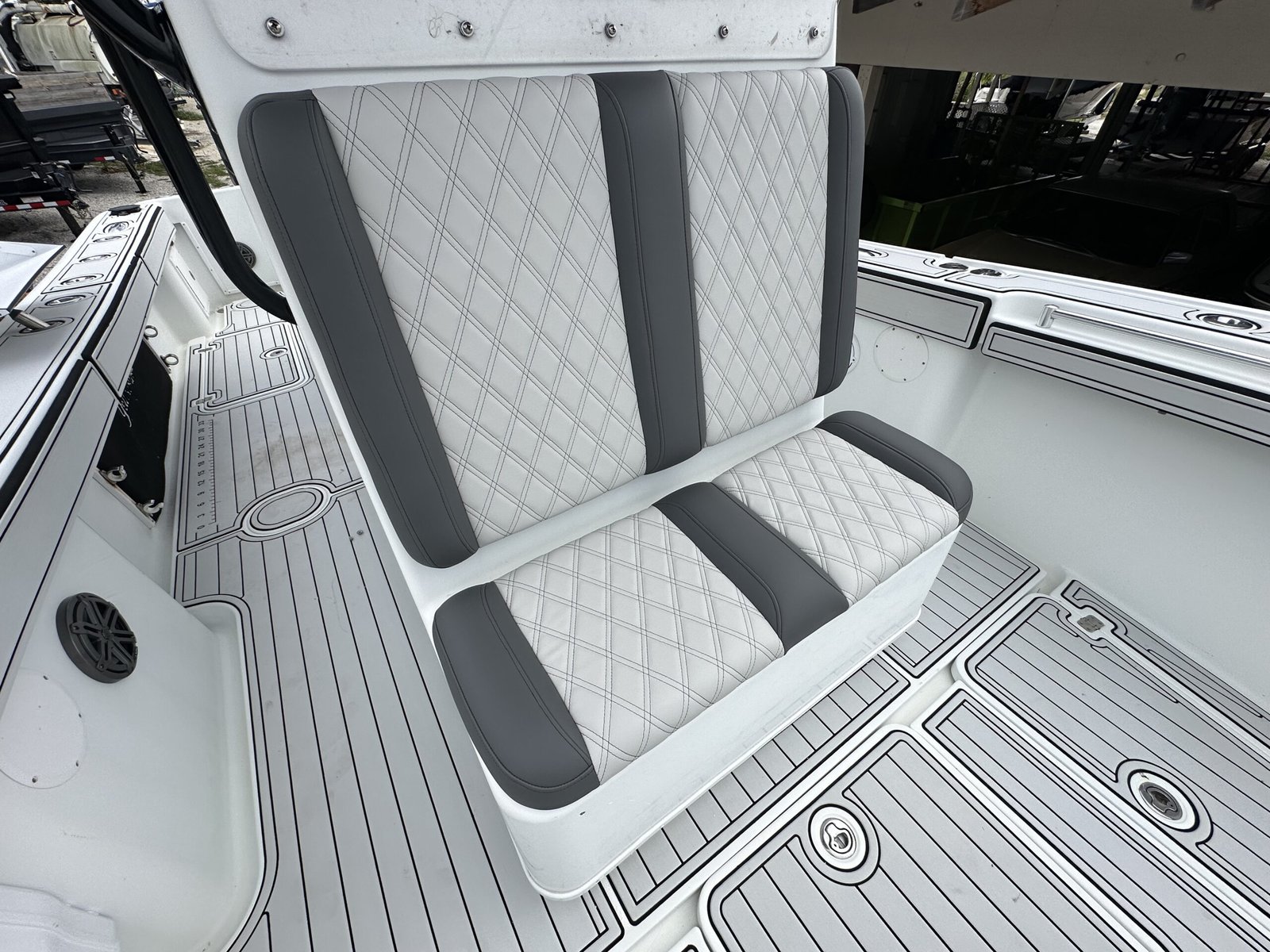 "Custom white marine upholstery for Mako 214CC boat" "Yellowfin boat with premium marine upholstery and embroidered logo" "Boat seat restoration with marine-grade vinyl and waterproof stitching" "Before and after boat upholstery transformation" "Non-slip boat seating with UV-resistant materials"