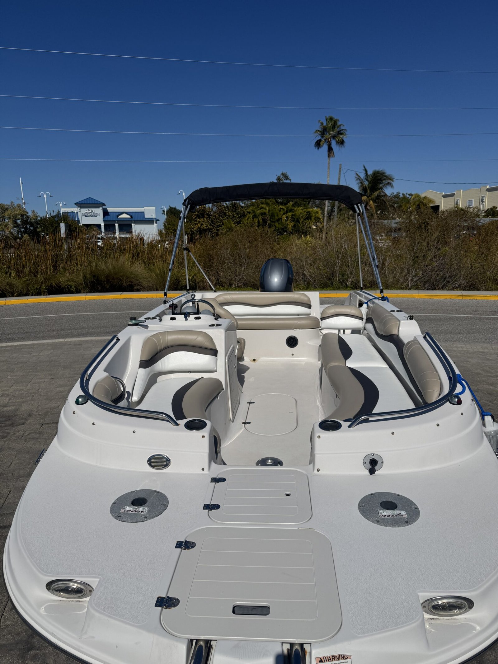Boat Interior Being Inspected For Upholstery Replacement — Marine Technician Checking Cushion Condition Venice Fl | Apogee Upholstery